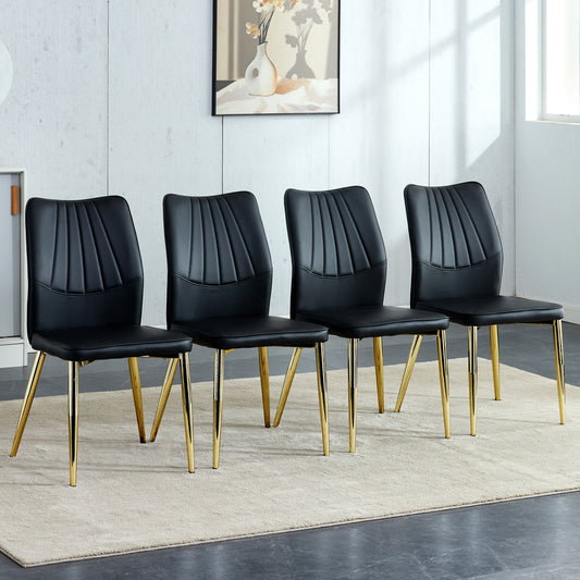 Four Black and Gold Dining Chairs